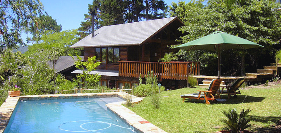 Pool and main cottage at Zauberberg Cottage
